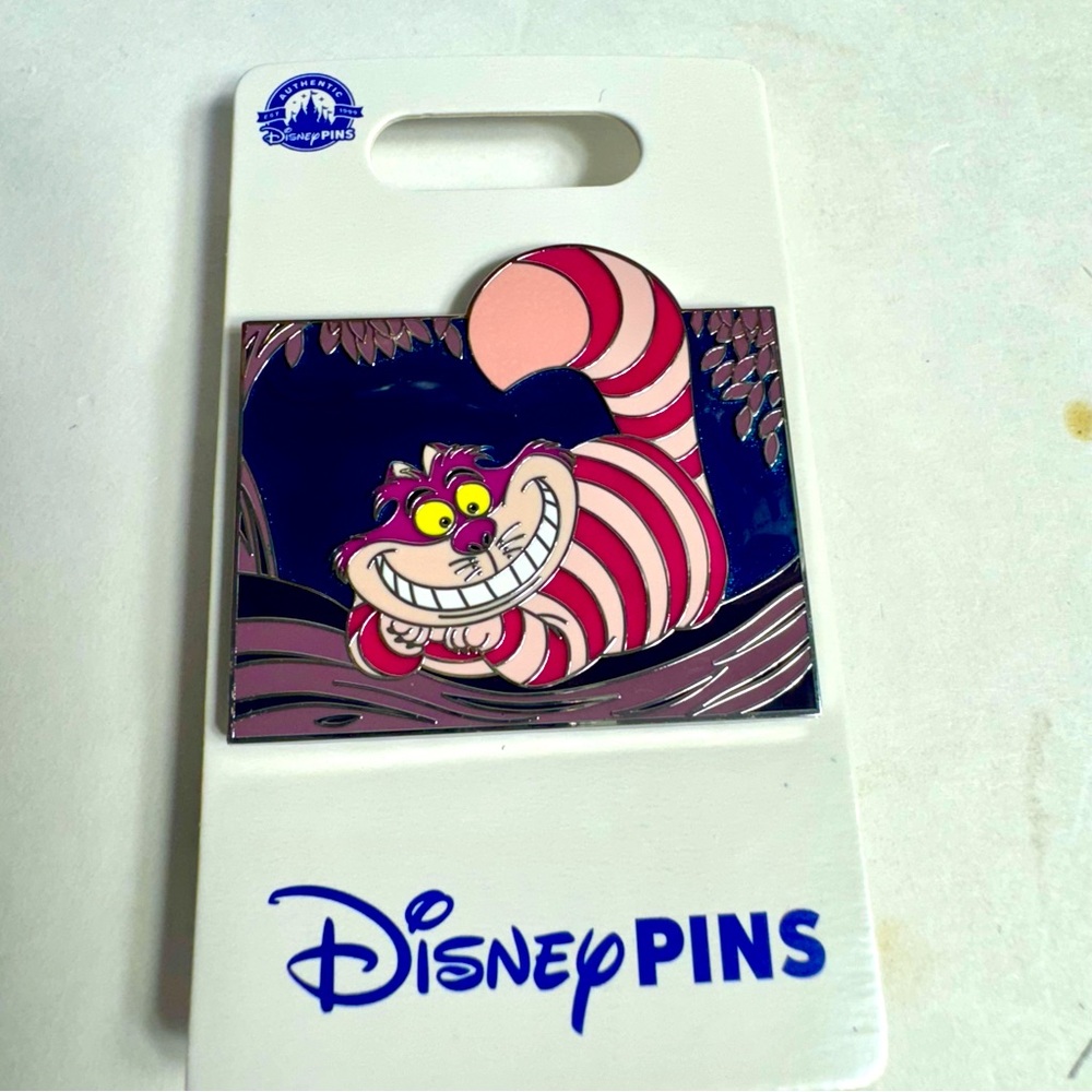 NWT. Disney Parks Alice in Wonderland Cheshire Cat Disney Trading Pin.